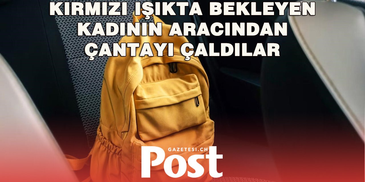 Kırmızı Işıkta Beklerken Otomobiline Girip Çantasını Çaldılar